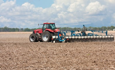 Tractor plowing field in America